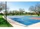 Community basketball court with benches, volleyball court, and trees on a sunny day perfect for sports at 2425 W Bronco Butte Trl # 2028, Phoenix, AZ 85085