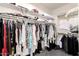 Walk-in closet with rows of shelving and clothing racks at 2425 W Bronco Butte Trl # 2028, Phoenix, AZ 85085