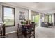 Cozy dining area with neutral colors, a small table and a view of the deck at 2425 W Bronco Butte Trl # 2028, Phoenix, AZ 85085