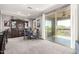 An open dining area with a full bar and sliding glass doors to a deck area at 2425 W Bronco Butte Trl # 2028, Phoenix, AZ 85085