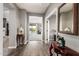 Hallway featuring wood-look tile flooring with views to the living room and outdoor patio at 2425 W Bronco Butte Trl # 2028, Phoenix, AZ 85085