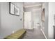 Hallway with a bench seat and a view to the bathroom with a glass enclosed shower at 2425 W Bronco Butte Trl # 2028, Phoenix, AZ 85085