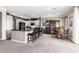 Open-concept kitchen featuring a large island, modern appliances, and a nearby dining area at 2425 W Bronco Butte Trl # 2028, Phoenix, AZ 85085