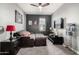 Cozy living room with a plush sofa, a large window, and a modern ceiling fan at 2425 W Bronco Butte Trl # 2028, Phoenix, AZ 85085