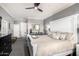 Bright main bedroom with a white bedframe, black dresser and ensuite bath at 2425 W Bronco Butte Trl # 2028, Phoenix, AZ 85085