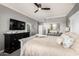 Neutral main bedroom with a black dresser and a view of the ensuite bathroom at 2425 W Bronco Butte Trl # 2028, Phoenix, AZ 85085