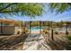 Gated community pool area offering relaxation and recreation under a sunny sky at 2425 W Bronco Butte Trl # 2028, Phoenix, AZ 85085