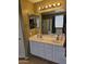 This lovely bathroom features double sinks, and a shower tub combination with bright lighting at 2514 W Big Oak St, Phoenix, AZ 85085