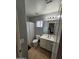 Compact bathroom features a toilet, vanity, and shower at 2514 W Big Oak St, Phoenix, AZ 85085