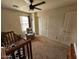 Bright bedroom with a crib, a chair, and a window for ample natural light at 2514 W Big Oak St, Phoenix, AZ 85085