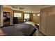 Open bonus room with dresser, desk, and view of a bedroom at 2514 W Big Oak St, Phoenix, AZ 85085