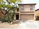 Charming two-story home featuring desert landscaping, a two-car garage, and a covered entryway at 2514 W Big Oak St, Phoenix, AZ 85085