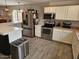 Stainless steel appliances and white cabinets in this updated kitchen at 2514 W Big Oak St, Phoenix, AZ 85085