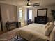 This comfortable main bedroom boasts a ceiling fan, neutral walls, and abundant natural light at 2514 W Big Oak St, Phoenix, AZ 85085