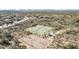 Aerial view of tennis courts and basketball court in a neighborhood setting at 2610 W Sat Nam Way, Phoenix, AZ 85086