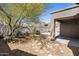 Landscaped backyard featuring desert plants, gravel, trees and iron fence at 2610 W Sat Nam Way, Phoenix, AZ 85086