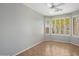 Bedroom with tile floor, ceiling fan, and plantation shutters at 2610 W Sat Nam Way, Phoenix, AZ 85086