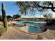 Wonderful community pool with nearby spa and desert landscaping at 2610 W Sat Nam Way, Phoenix, AZ 85086