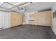Garage with built in cabinets, water heater and overhead lighting at 2610 W Sat Nam Way, Phoenix, AZ 85086