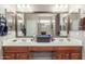 Spacious bathroom with double sinks, vanity, large mirror, and walk-in shower at 269 W Seaside Dr, Casa Grande, AZ 85122