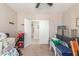 Multi-purpose bedroom with a ceiling fan and an open door at 269 W Seaside Dr, Casa Grande, AZ 85122