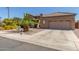 Beautiful single-story home with desert landscaping, driveway and a welcoming facade at 269 W Seaside Dr, Casa Grande, AZ 85122