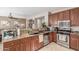Modern kitchen featuring granite countertops, stainless steel appliances, and tile flooring at 269 W Seaside Dr, Casa Grande, AZ 85122