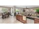 Open kitchen with a view of the dining area, granite countertops, and stainless steel appliances at 269 W Seaside Dr, Casa Grande, AZ 85122