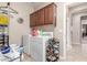 Laundry room featuring a washer, dryer, storage, and dark cabinets at 269 W Seaside Dr, Casa Grande, AZ 85122