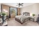 Comfortable main bedroom with a large window, stylish décor, and plenty of natural light at 269 W Seaside Dr, Casa Grande, AZ 85122