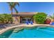 Backyard pool with step entry offers a refreshing oasis with patio area and desert landscaping at 269 W Seaside Dr, Casa Grande, AZ 85122