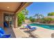 Backyard pool with lounge chairs and patio with desert landscaping for leisure and entertainment at 269 W Seaside Dr, Casa Grande, AZ 85122