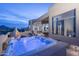 Enjoy the outdoors with the hot tub, fireplace, and seating area on the back patio at 28437 N 112Th Way, Scottsdale, AZ 85262