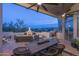 Spacious covered patio boasting an outdoor kitchen, fireplace, and dining area; perfect for entertaining at 28437 N 112Th Way, Scottsdale, AZ 85262