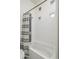 Bright bathroom featuring a tub with jets, a shower with stylish curtain and tiled walls, and uniquely placed glass block windows at 28437 N 112Th Way, Scottsdale, AZ 85262