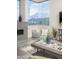Serene living room with floor to ceiling windows with mountain views and comfortable seating at 28437 N 112Th Way, Scottsdale, AZ 85262