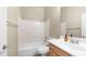 Bathroom featuring a shower-tub combo with a white sink and light wooden cabinets at 3131 E Legacy Dr # 2055, Phoenix, AZ 85042