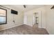 Bedroom featuring wood-look flooring and an arched doorway leading to a walk-in closet at 3131 E Legacy Dr # 2055, Phoenix, AZ 85042