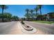This gated community features well-maintained landscaping with desert plants and lush trees at 3131 E Legacy Dr # 2055, Phoenix, AZ 85042