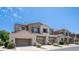 Attractive townhome featuring desert landscaping, attached garages, and a private balcony at 3131 E Legacy Dr # 2055, Phoenix, AZ 85042