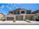 Inviting townhome featuring beige paint, desert landscaping and convenient attached garages at 3131 E Legacy Dr # 2055, Phoenix, AZ 85042