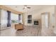 Cozy living room with a fireplace, ceiling fan and natural lighting at 3131 E Legacy Dr # 2055, Phoenix, AZ 85042