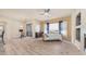 Bright living room with wood flooring, ceiling fan, and a sliding glass door at 3131 E Legacy Dr # 2055, Phoenix, AZ 85042