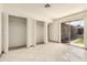 Spacious bedroom with tile flooring, two large closets and sliding glass door access to exterior at 3136 W Voltaire Ave, Phoenix, AZ 85029