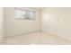 Bedroom with tile flooring and a window at 3136 W Voltaire Ave, Phoenix, AZ 85029