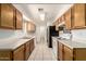 Galley kitchen with generous storage, essential appliances, and durable tile flooring at 3136 W Voltaire Ave, Phoenix, AZ 85029