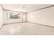 Bright and airy living room featuring tile flooring, fresh paint, and natural light at 3136 W Voltaire Ave, Phoenix, AZ 85029