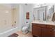 Well-lit bathroom with a combination tub/shower, vanity with sink, and tile flooring at 34457 N Legend Trail Pkwy # 1013, Scottsdale, AZ 85262
