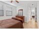 Tranquil bedroom with natural light, wood floors, and classic furnishings for relaxation at 34457 N Legend Trail Pkwy # 1013, Scottsdale, AZ 85262