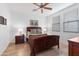 Cozy bedroom with a wood-framed bed, neutral decor, and a ceiling fan for added comfort at 34457 N Legend Trail Pkwy # 1013, Scottsdale, AZ 85262